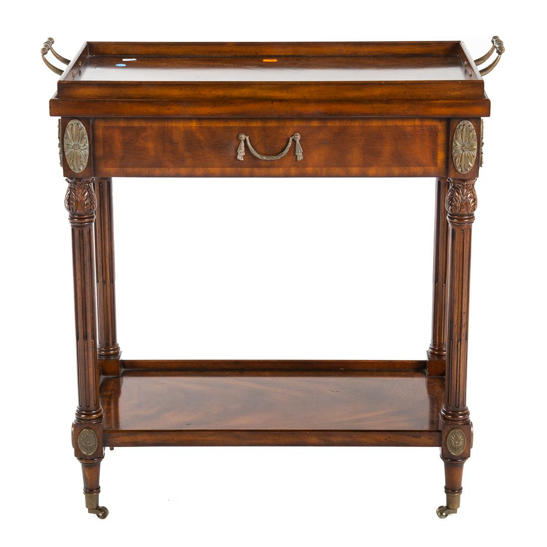 Maitland-Smith Regency Style Mahogany Tea Cart: With removable two-handle tray top, with mounted brass rosettes and castors. 32 in. H., 28.5 in. L., 15 in. D.