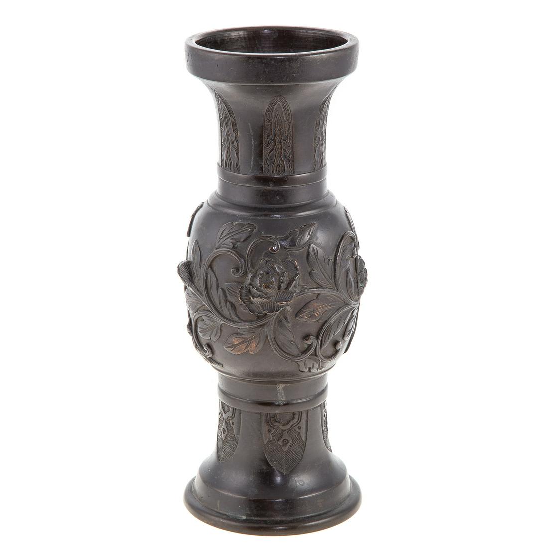 Japanese Bronze Vase: Late 19th century; having foliate relief decorated center, impressed character mark underneath, 11 in. H., 4 in. Diam.