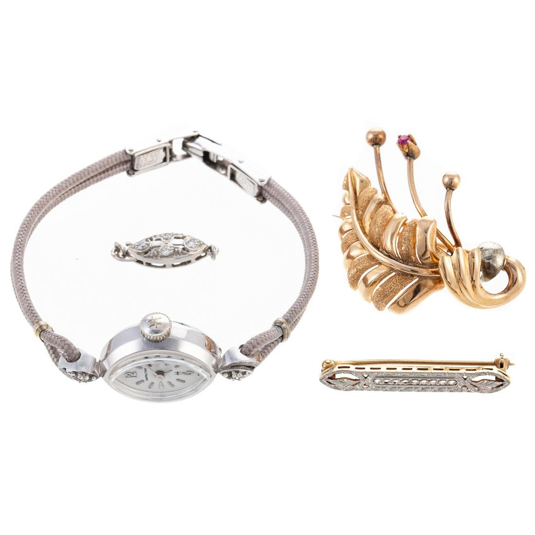 A Vintage Watch & Other Gold & Platinum Jewelry: 1) 18K yellow gold leaf pin with high polish and sandblasted finishes with prong set synthetic ruby, safety clasp, 1.5 in. L, 2) 14K bi-color gold vintage filigree bar pin, safety clasp, 1.25 in. L, 3