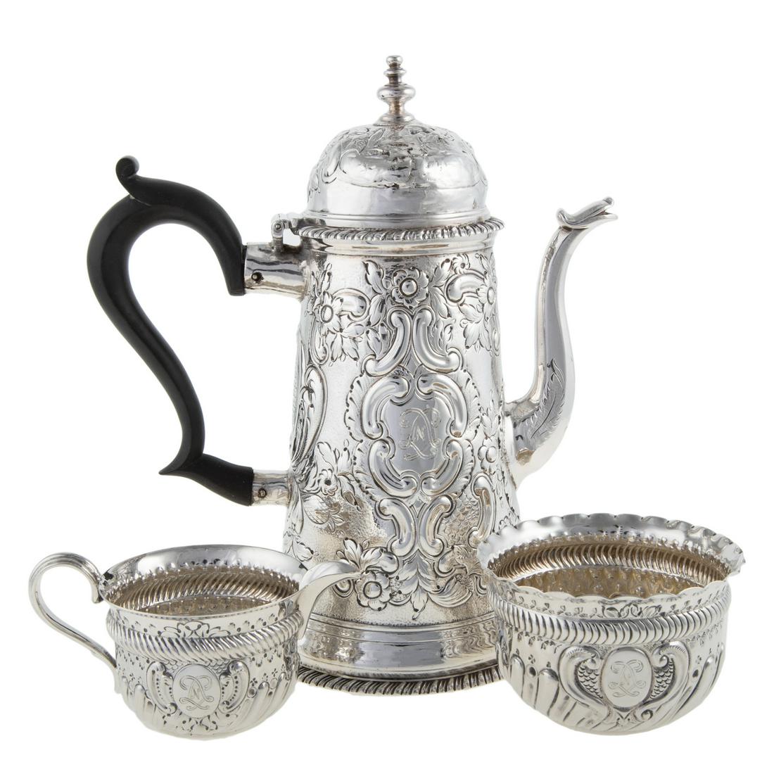 Three-Piece Assembled English Coffee Service: Including a Queen Anne style coffee pot, creamer and matching sugar. Each with repousse decoration and monogrammed LNL for Linda Noe Laine; coffee pot is 8 in. H, 21.05 ozt., total weight Estate of Li