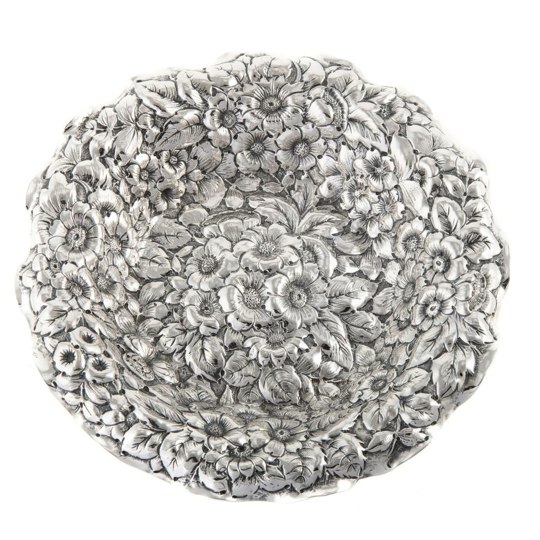 George W Shiebler Sterling Repousse Dish: Late 19th-early 20th century; Shallow well dish, in an allover floral repousse decoration, ruffle rim; 1 in. H, 7 1/4 in. Diam. Estate of Linda McRae Noe Laine, heiress and philanthropist, Lake Tahoe,