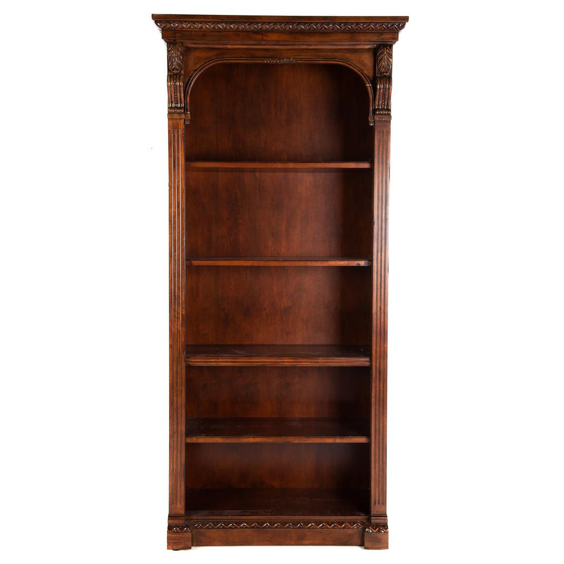 Hekman Classical Style Carved Wood Bookcase: With two adjustable shelves. 85.5 in. H., 40 in. W., 18 in. D. Estate of Linda McRae Noe Laine, heiress and philanthropist, Lake Tahoe, Nevada and Washington, DC.