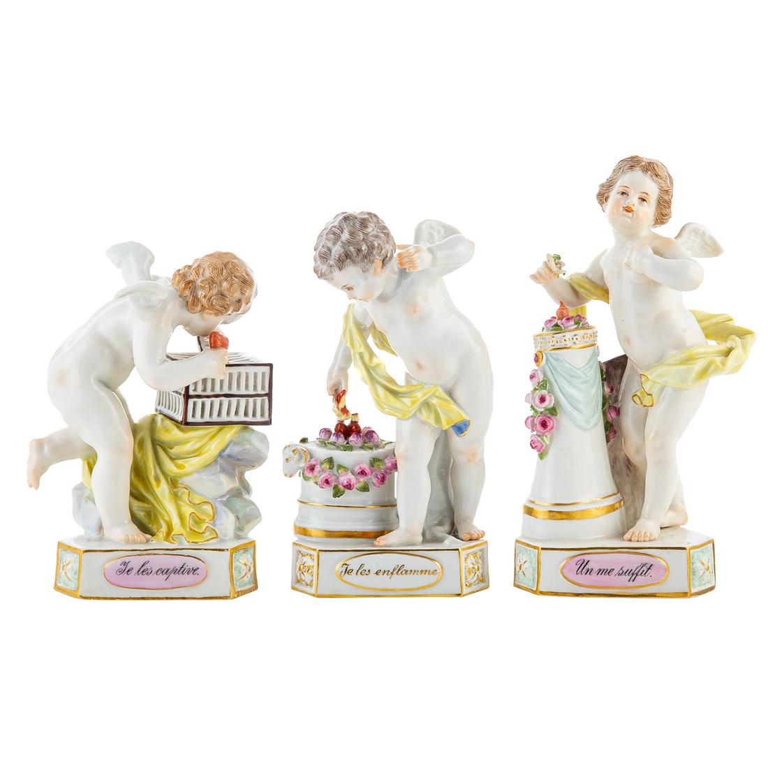 Three Meissen Porcelain Allegory of Love Figures: Early 20th century; figure of putto on triangular base with gilt lettered title, each figure representing a facet of love and courtship, 4 1/2 to 6 in. H. Estate of Linda McRae Noe Laine, heiress and 