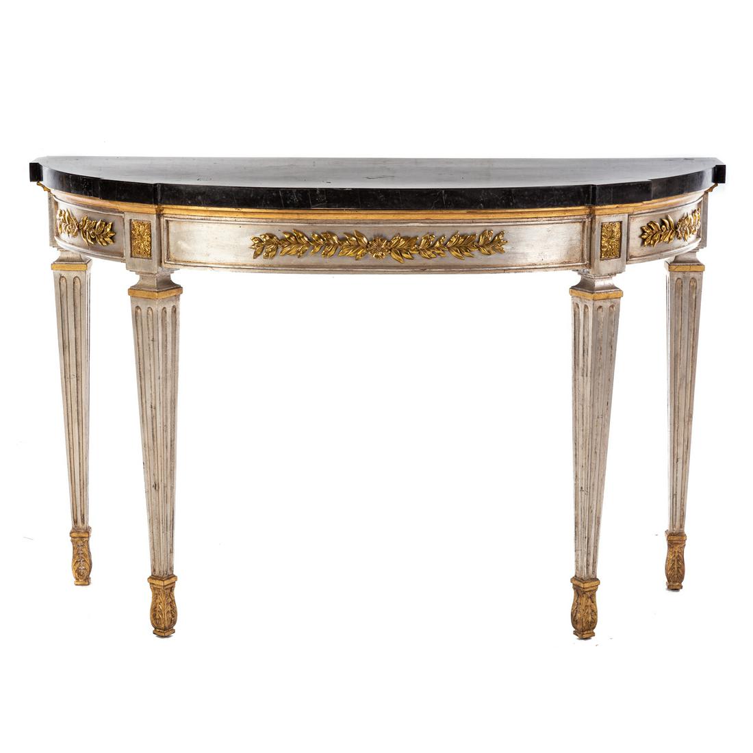 Henredon Marble Top Demilune Console: 20th century; having shaped marble top with brass string inlay, with gilt metal mounts. 35 in. H., 21.5 in. D., 54 in. W. Estate of Linda McRae Noe Laine, heiress and philanthropist, Lake Tahoe, Nevad