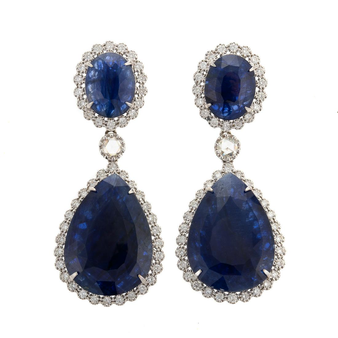 Impressive GIA 23.12 ctw Sapphire Earrings in 18K: 18K white gold earrings boasting oval cut and pear shape sapphires with deep royal blue color, weighing 23.12 ctw and originating from Afghanistan, accompanied by GIA Sapphire Origin Report #621478216