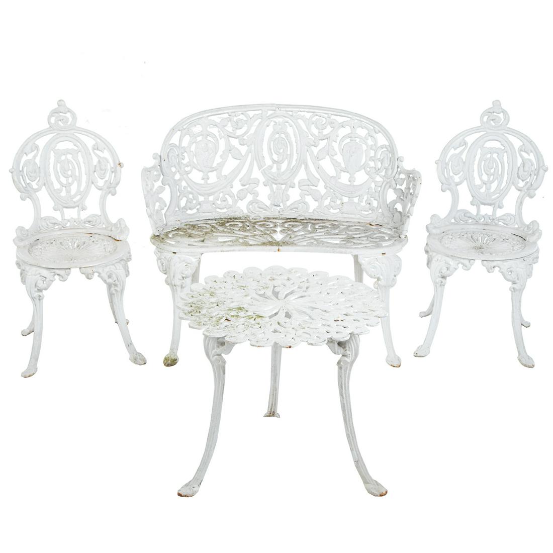 Four-Piece Atlanta Stove Works Patio Set: Circa 1890-1910; heavy cast iron classical style four piece suite comprising settee, pair of chairs and side table, all marked "Atlanta Stove Works," settee - 30 in. H., 36 in. W.