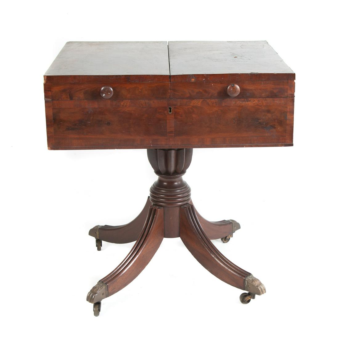 American Classical Mahogany Harmonicon Case: Baltimore, 1825-30; mahogony case with two top doors, open to reveal area for musical glassware, interior with bird's eye maple veneer sides, well carved reeded legs and pedestal, having brass ends wi