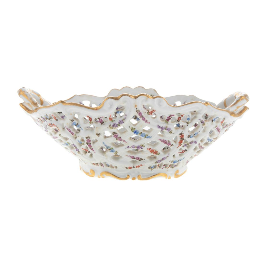 Meissen Porcelain Reticulated Berry Basket: Early 20th century; floral decorated basket with extensive gilt accents, 4 in. H., 10 1/2 in. L. From the family and descendents of Charles Potts Talbot (1807-1884) and Harriet Rogers Talbot, of Bille