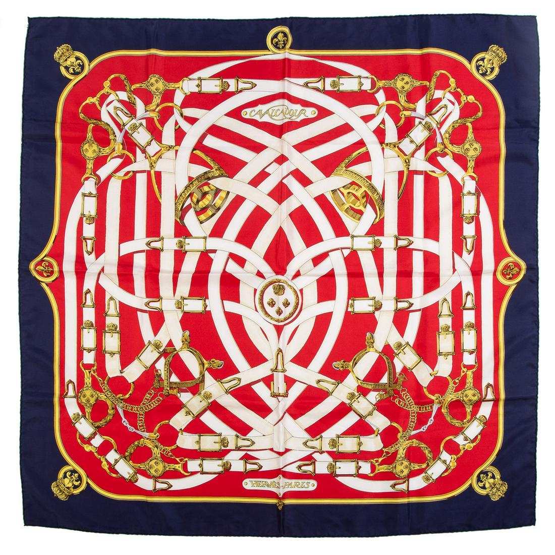 An Hermes Scarf â€œCavalcadour” Scarf 90: Red and multicolor Hermes 90 cm silk scarf with â€œCavalcadour” motif and hand rolled edges