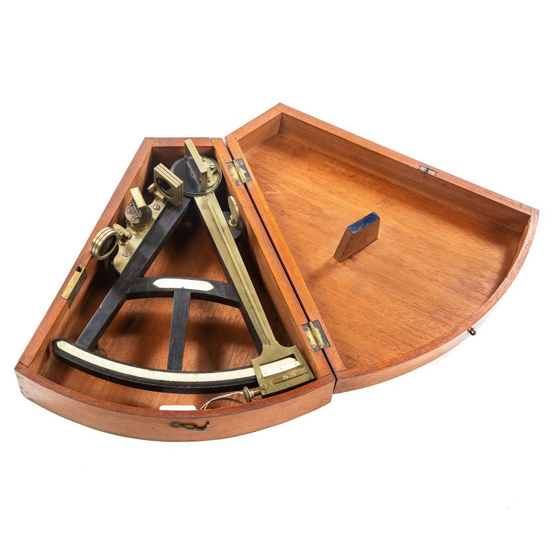 "Hadley's Quadrant" (Octant) in Mahogany Case: No maker's mark, 1st half 19th century; Ebony frame with brass fittings,11 1/4 in. L.; housed in a mahogany case. From the estate of a Maryland collector.