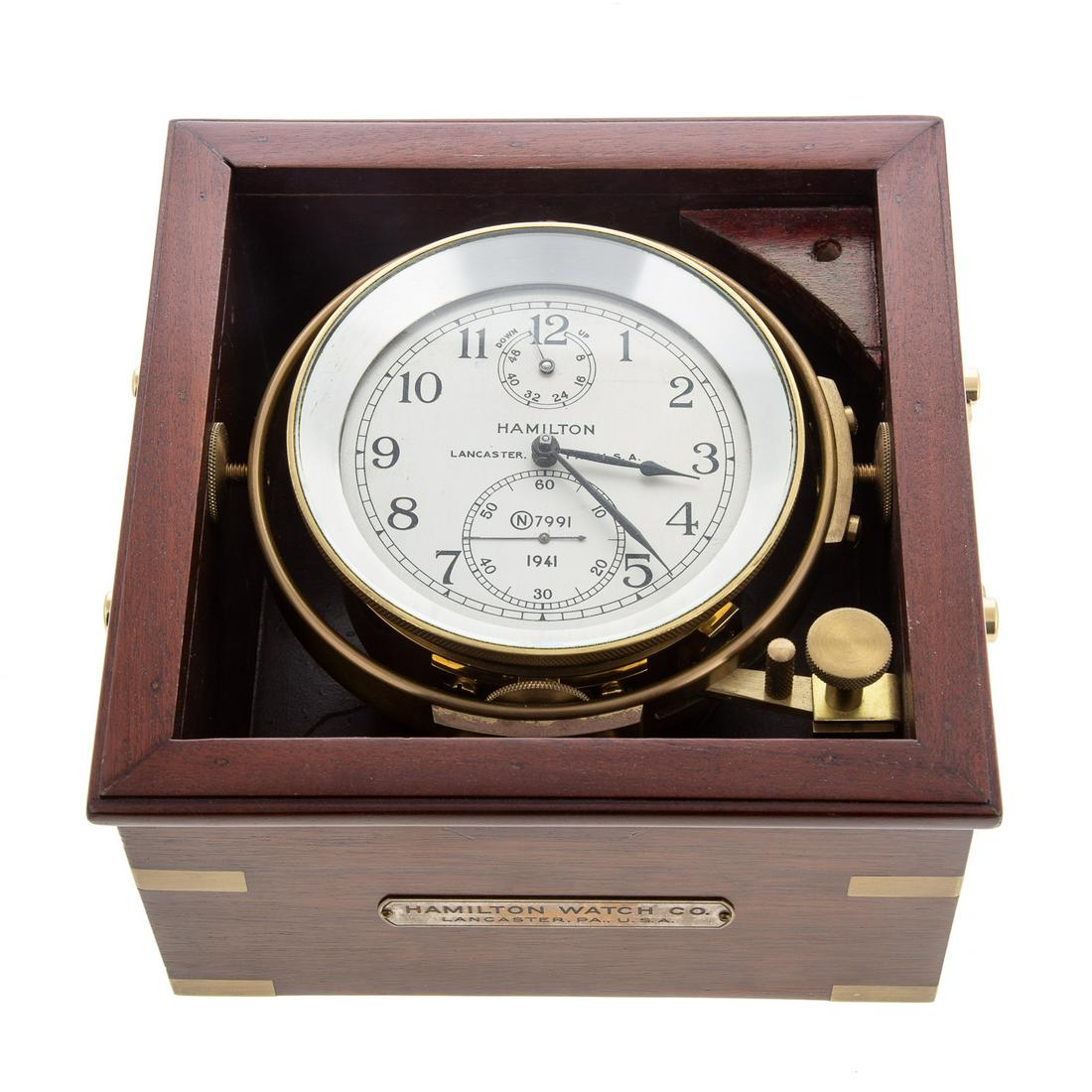 Hamilton Naval Chronometer, N7991, Dated 1941: Measures 4 7/8 in. round. In 8 x 8 in.; in original brass-mounted mahogany box. With a fusee chain. From the estate of a Maryland collector.