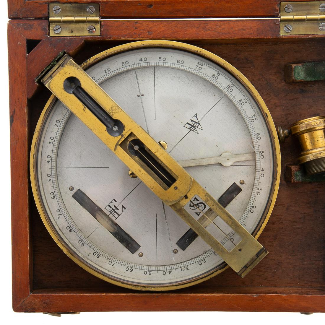Engraved Surveyor's Brass Compass in Box: No maker's name evident, 2nd half 19th century, with folding vanes and a pair of levels; brass, the compass dial silvered, with niello engraving, 5 1/4 in. diam.; in a 6 x 7 1/2 in. box. From the esta