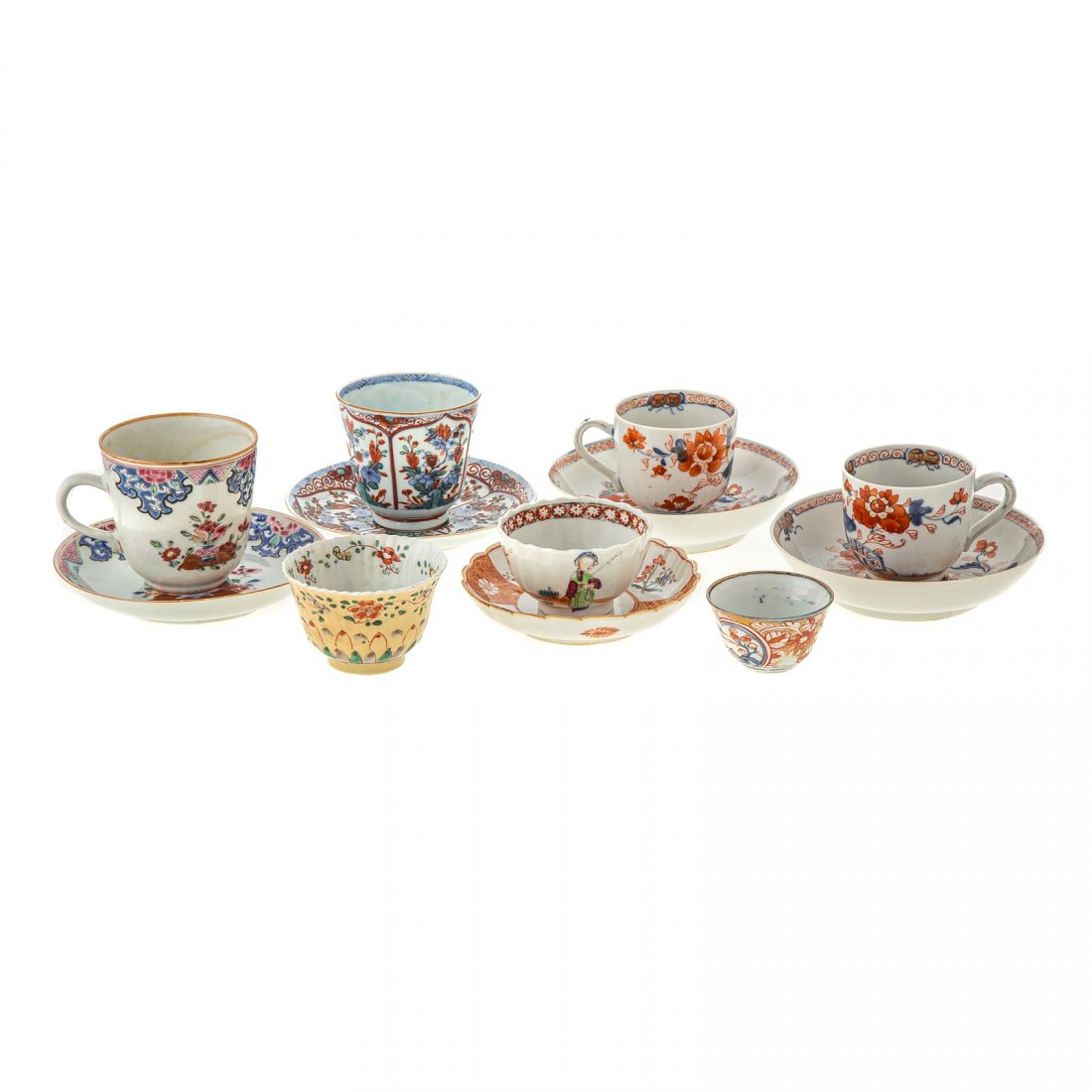 12 Pieces Chinese Export Cups & Saucers: 18th century; includes pair Imari teacups and saucers, Famille Rose cup and saucer, Doucai cup and saucer, cup with Kang Xi mark, Famille Verte on Cafe Au Lait ground with Kang Xi mark, small Imari cu