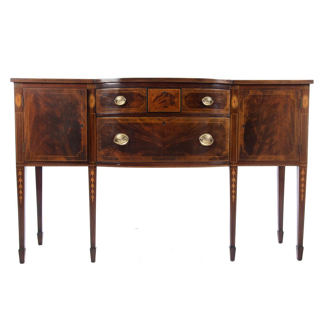 Potthast Br14s Federal Style Inlaid Sideboard: Mid-20th century; shaped front with elaborate stringer, bellflower and patera inlays, two stacked drawers flanked by cabinet doors. 39 in. H., 63 in. W., 23 in. D.