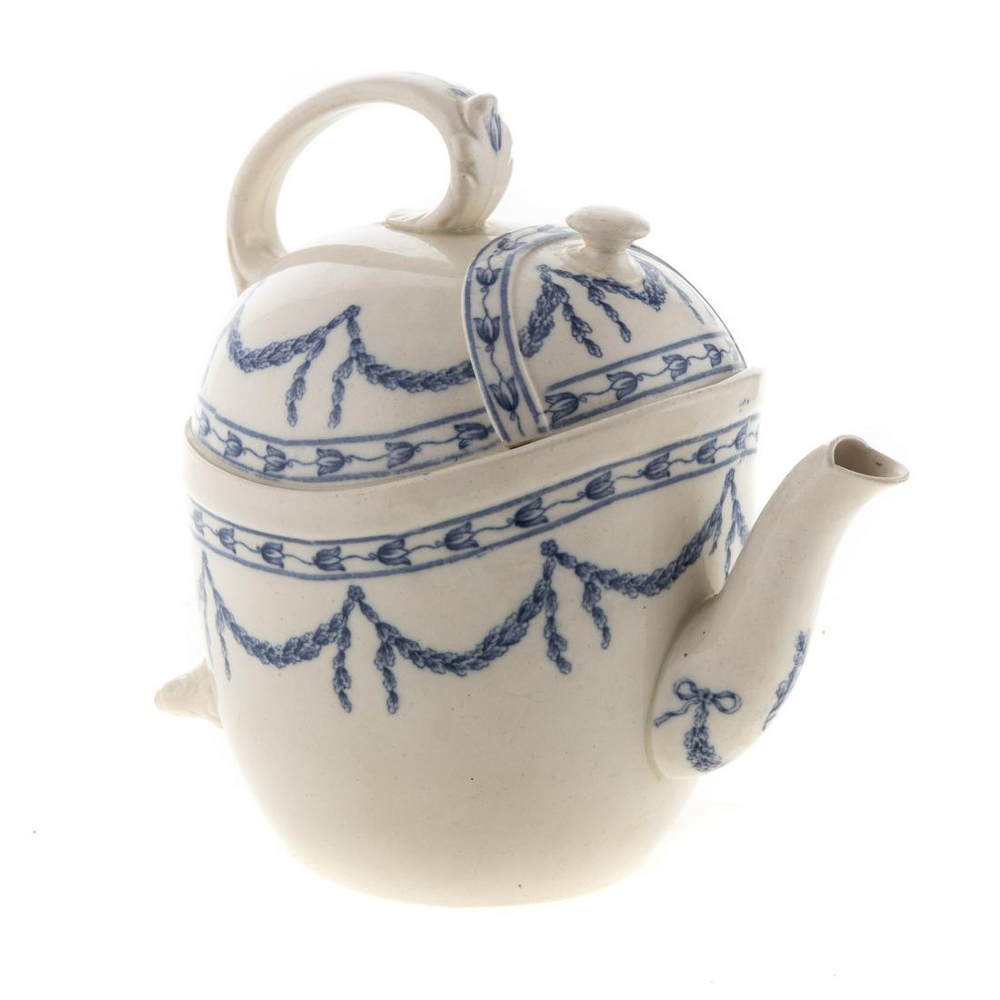 Rare Wedgwood SYP Teapot: Dated 1909; unusual design SYP(Simple Yet Perfect), teapot with fixed interior strainer and blue swag transfer decoration in the "Oaklands" pattern, with impressed and stamped marks, 8 in. H.