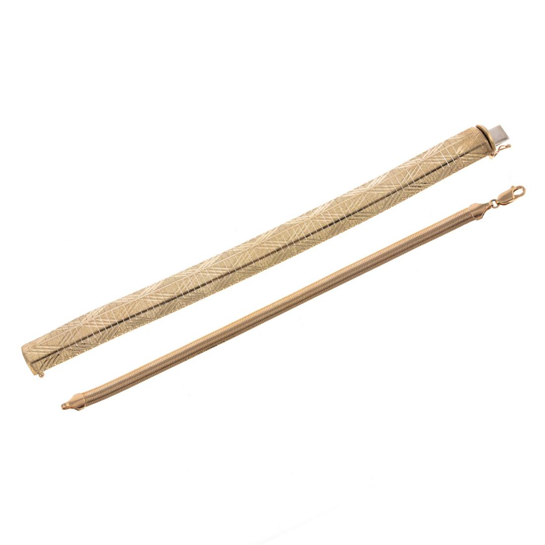 Two 14K Yellow Gold Link Bracelets: 1) 14K yellow gold Omega link bracelet with crosshatch decoration, hidden box clasp, with safety latch, 7 in. L, and 2) 14K yellow gold rounded herringbone link bracelet, lobster clasp, 7 in. L, 31.6