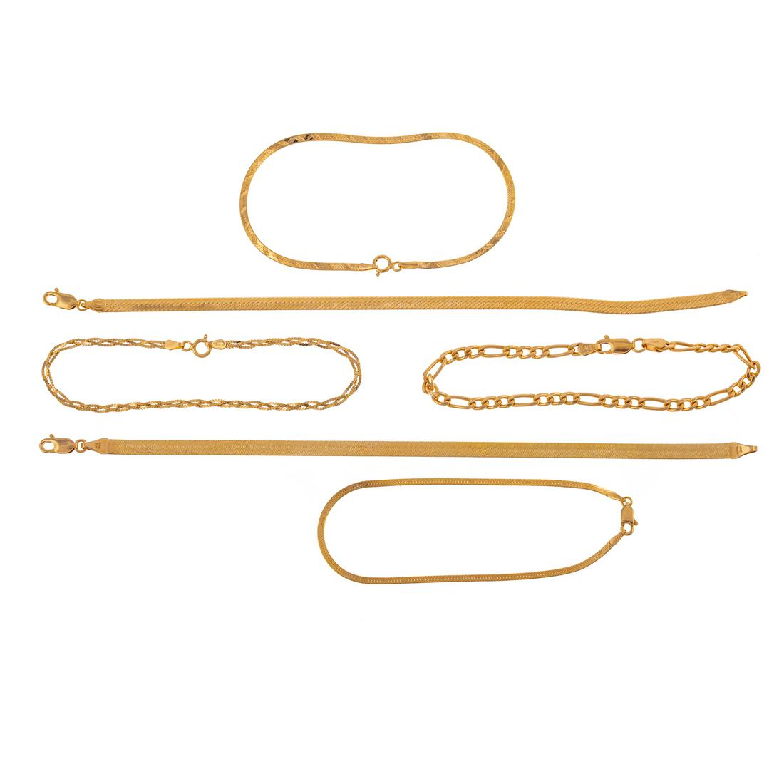 A Collection of Six Chain Link Bracelets in 14K: Six 14K yellow gold assorted chain link bracelets, including herringbone, figaro, and woven serpentine, each 7 in. L, 12.5 grams tw The Estate of Susan Kaufmann.