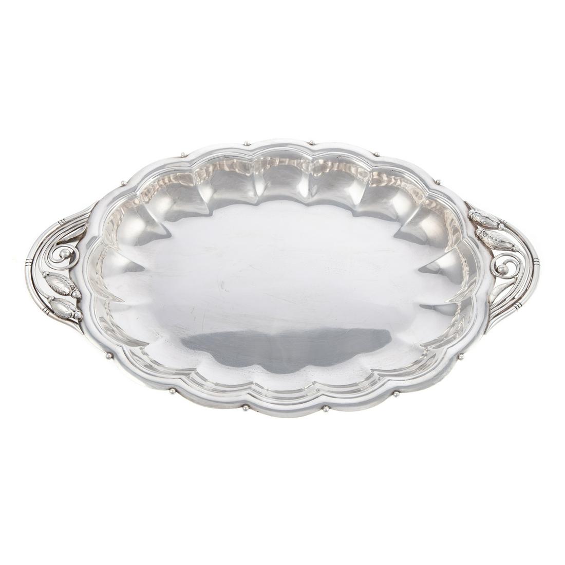 Georg Jensen-Style Sterling Serving Dish: Without maker's mark, model# 427, oval, with lobed body, wavy rim punctuated with applied ball ornaments, openwork trailing blossom handles, 1 3/4 in. H, 18 5/8 in. L, 12 1/8 in. D, 42.40 ozt.