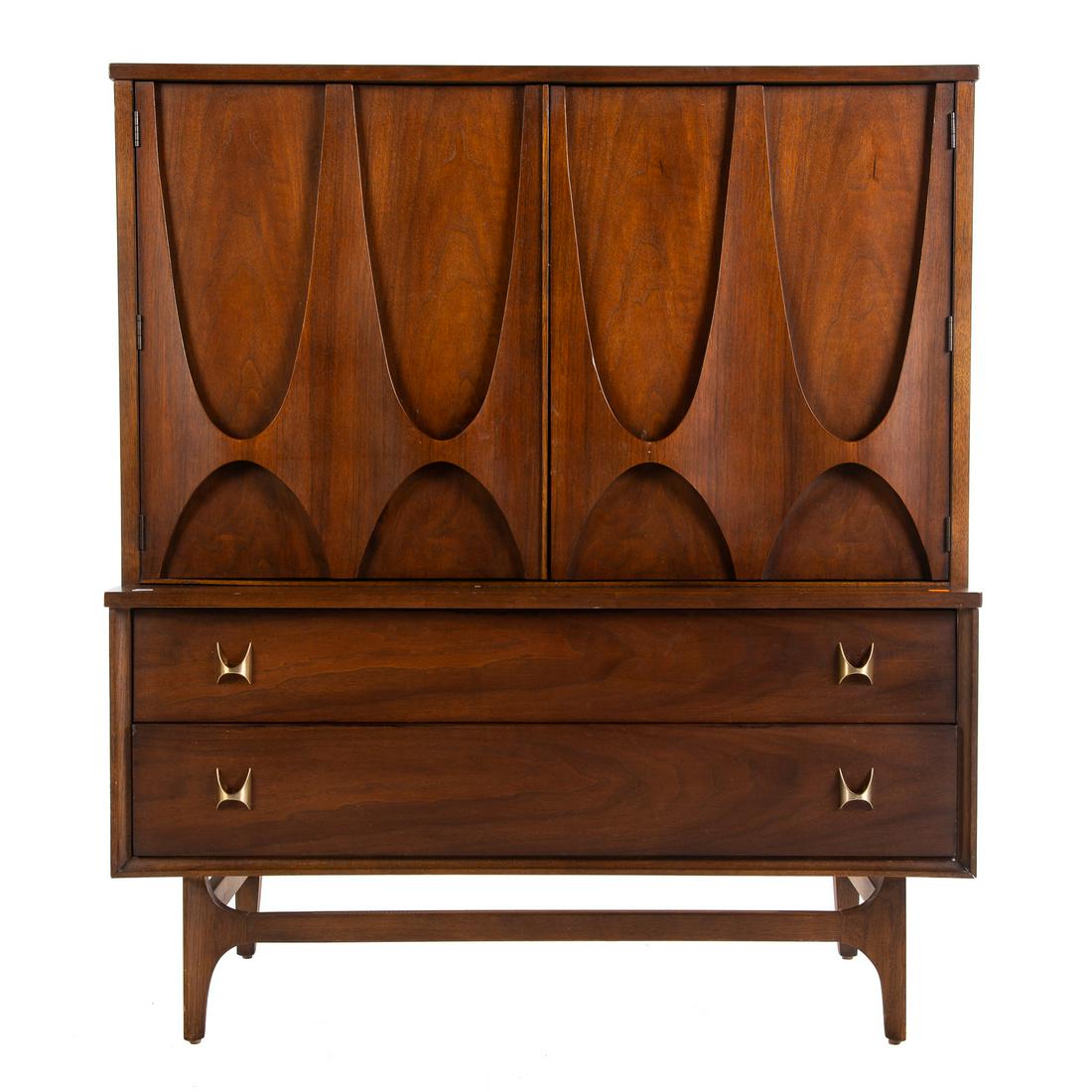 Broyhill Brasilia Gentleman's Chest: Mid-century; designed by Oscar Niemeyer for Broyhill, two long lower drawers, two upper cabinet doors, with two left shelves and four right drawers. 50 in. H., 44 in. W., 19.5 in. D.