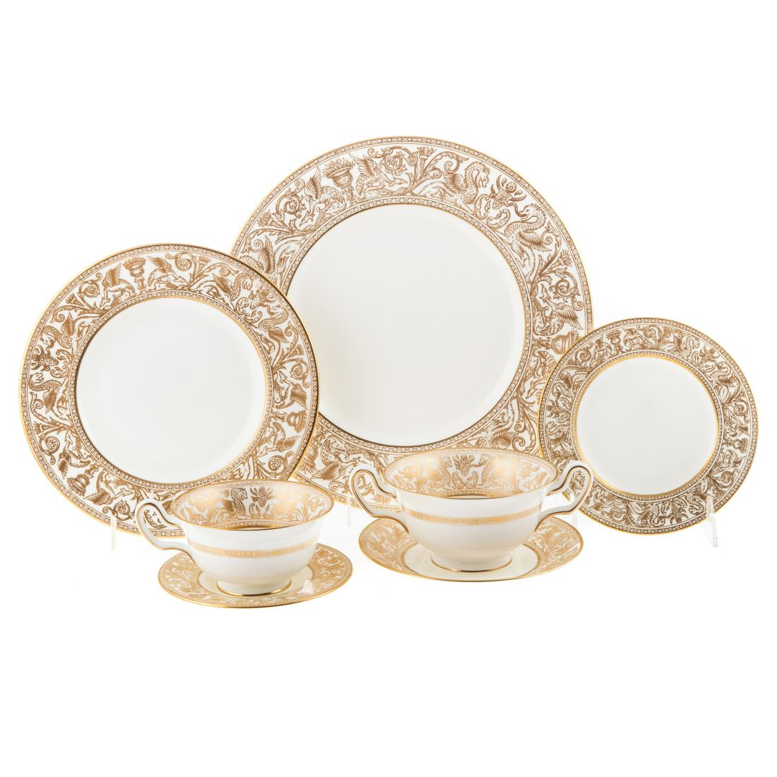 Wedgwood Gold Florentine Partial Dinner Service: Approx. 100 pieces, includes; 13 dinner plates, 13 lunch plates, 13 bread plates, 11 coffee/tea cups, 13 saucers, 7 bouillon cups, 6 saucers, and 12 demitasse saucers. Estate of Linda McRae Noe Laine,