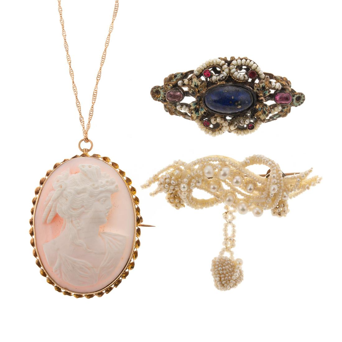 A Collection of Pins & Pendants: 1) 10K yellow gold angel skin coral cameo, locking c clasp and bail, with 14K rose gold chain, spring ring clasp, 22 in. L, 2) Seed pearl brooch with c clasp, 2 in. L, and 3) Antique brooch centering