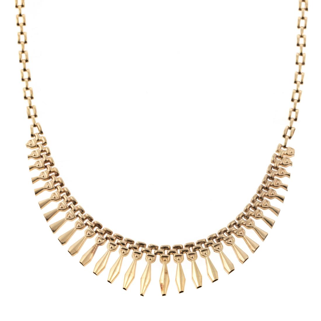 An Italian Fringe Necklace in 14K Yellow Gold: 14K yellow gold fringe necklace made in Italy, front half of necklace designed with tapering fringe, lobster clasp, 18 in. L, 13.5 grams