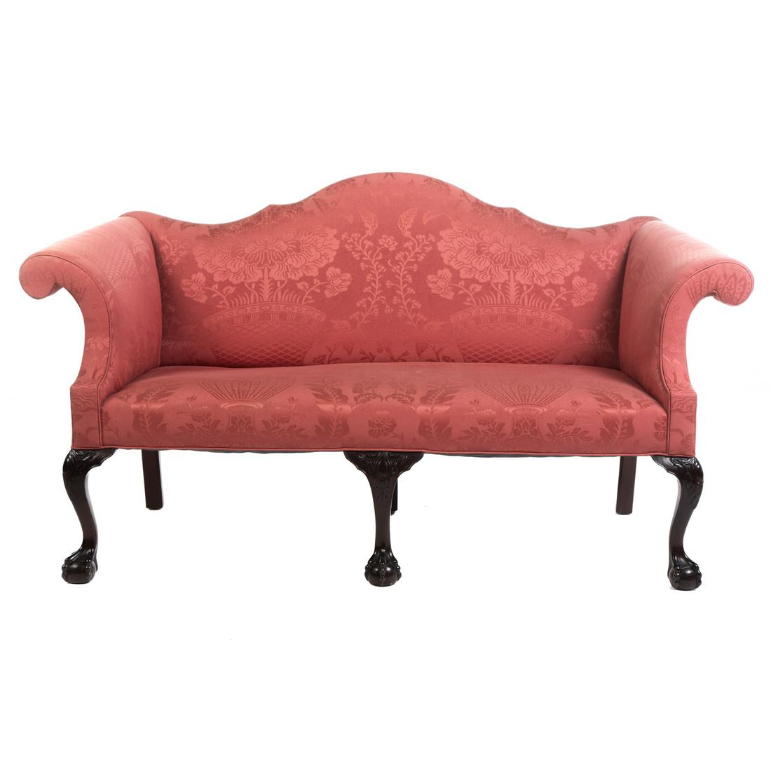 George II Style Carved Mahogany Upholstered Sofa: Late 19th/early 20th century; on cabriole legs ending in ball and claw feet, 37 in. H., 68 in. W., 29 in. D.
