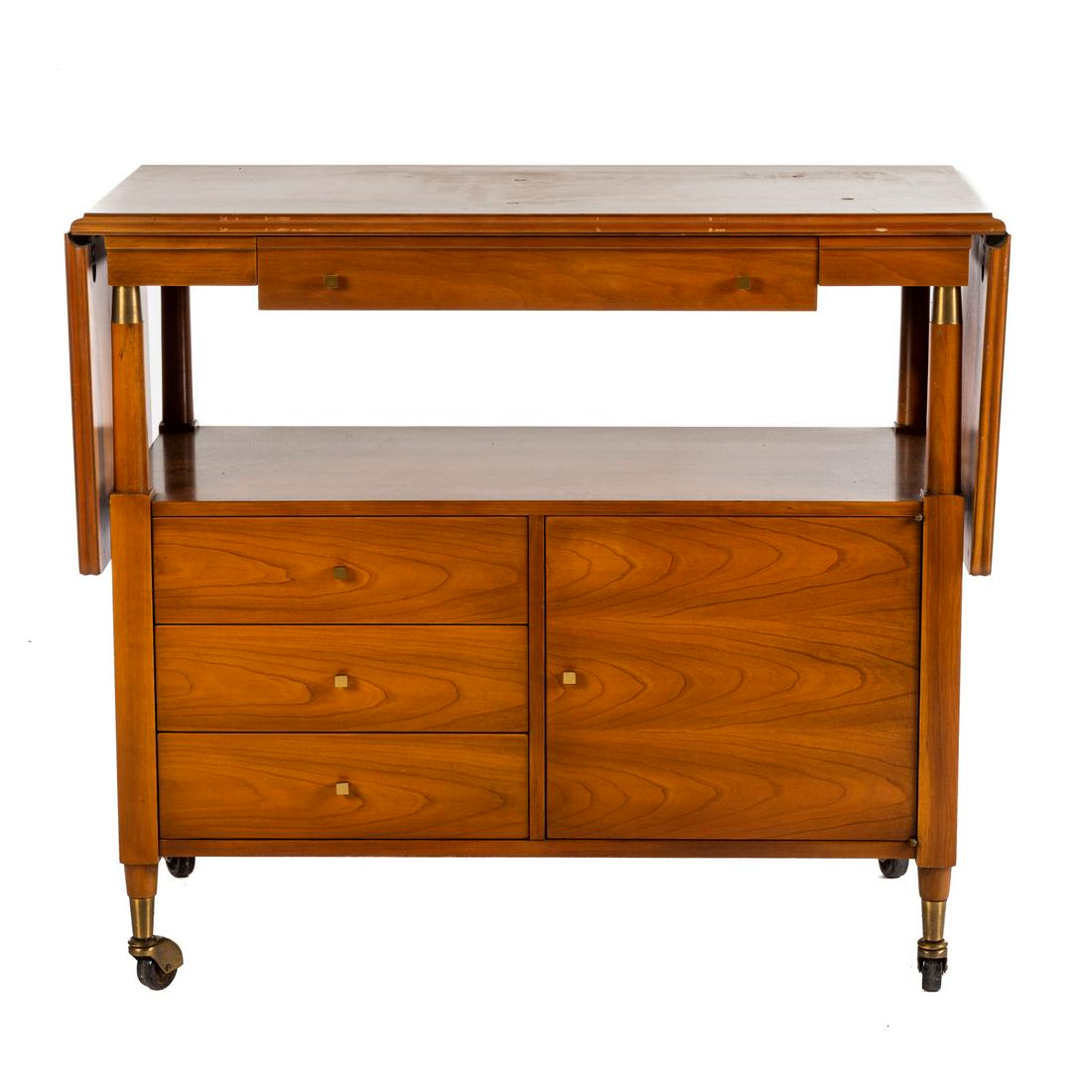 John Widdicomb Drop Leaf Tea Cart: Having top with long drawer, shelf area three stack drawers and cabinet door, 33 in. H., 38 in. W., 18 in. D. with two 14 in. drop leaves.
