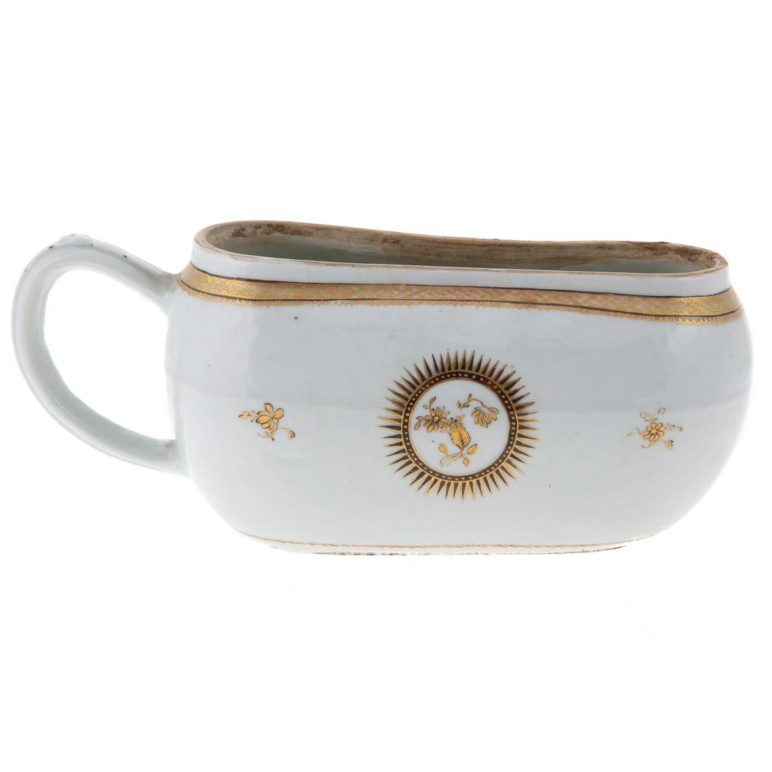 Museum Quality Chinese Export Porcelain Bourdaloue: Late Qianlong Era, circa 1780-90 with a gilt and sepia border, the body painted with sunbursts and similar sprays, handle with heart shaped thumb rest. A bordaloue is a woman's portable urinal. In wid