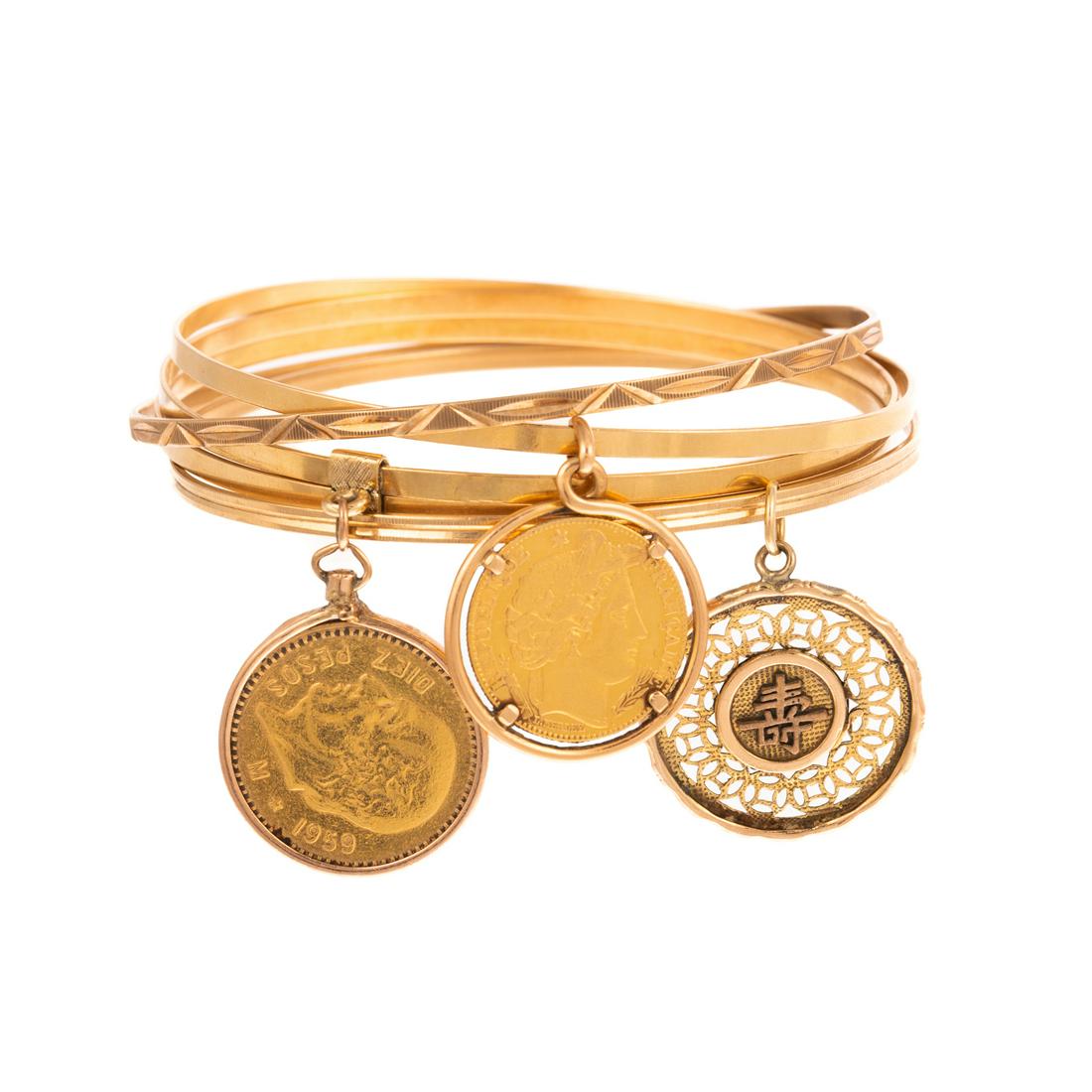 A Collection of Four Bangles with Coin Charms (1 of 8)