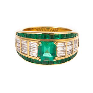 An 18K Fine Emerald & Diamond Ring by Picchiotti: 18K yellow gold ring by Picchiotti featuring a very fine emerald cut emerald, weighing approx. 1.16 cts, prong set in center and flanked by 24 baguette diamonds, weighing approx. 1.37 ctw, average