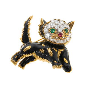 A Pave Diamond Enamel Cat Brooch in 18K: 18K yellow gold cat pin featuring very fine round cut diamonds weighing approx. 1.00 ctw with an average color grade of E-F and an average clarity grade of VVS pave set in head with emerald eyes and