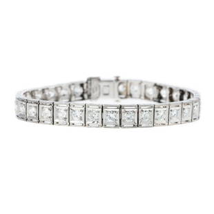 An Art Deco Diamond Line Bracelet in Platinum: c. 1920, platinum diamond line bracelet featuring 34 well-matched old European cut diamonds weighing approx. 4.00 carats with an average color grade of G-H and an average clarity grade of VS, each