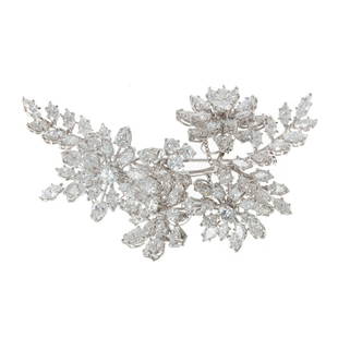 An Impressive French En Tremblant Diamond Brooch: 18K white gold, French, mid-century floral "en tremblant" brooch featuring diamond flowers and leaves, five diamond flowers on tremblers, well matched round, marquise and pear shape diamonds weighing