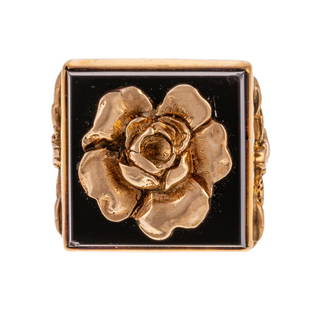 A Vintage 14K Yellow Gold Ring by Carl Schon: 14K yellow gold ring by Baltimore jeweler Carl Schon, square onyx, bezel set with a flower center, foliage shoulders, sz 5.25, 15 grams