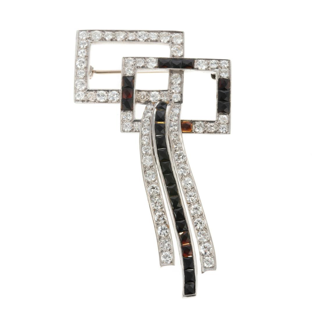 An Art Deco Diamond & Onyx Geometric Bow Pin (1 of 5)