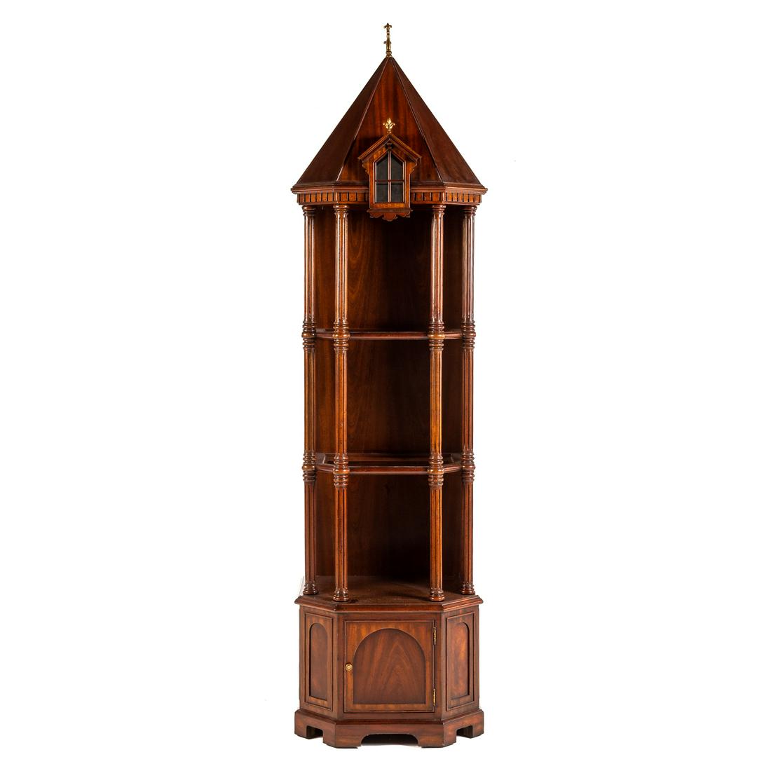 Maitland Smith Mahogany Curio Cabinet: 20th century; with paneled steeple top with reeded supports, removable inset glass shelves, with paneled base and single paneled door, illuminated top, 84 in. H., 20 in. W., 17 in. D.