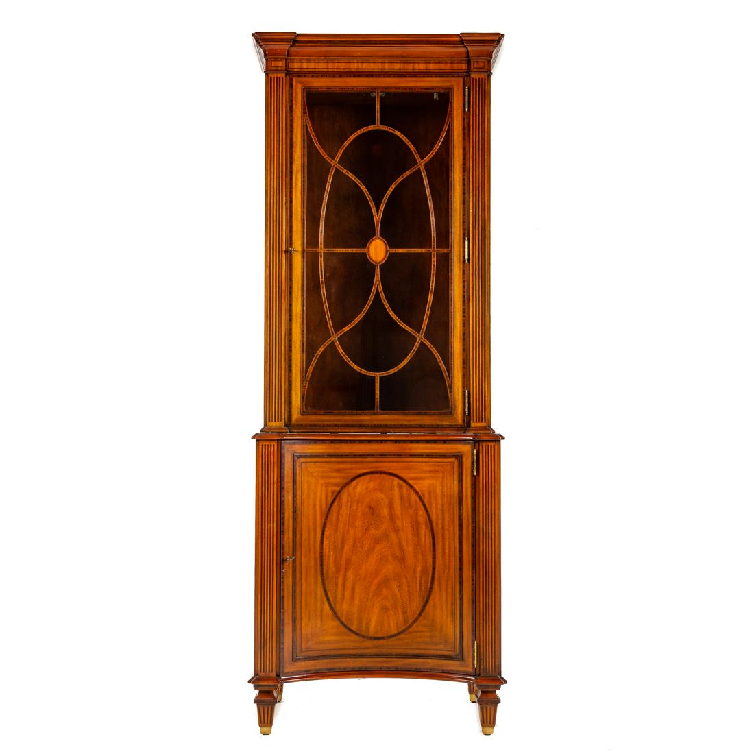 Maitland Smith Inlaid Curio Cabinet: 20th century; with molded cornice, with elaborate string and reeded inlays, single glass panel door, with adjustable glass shelves, illuminated top over similar inlayed bottom case with curved panel d
