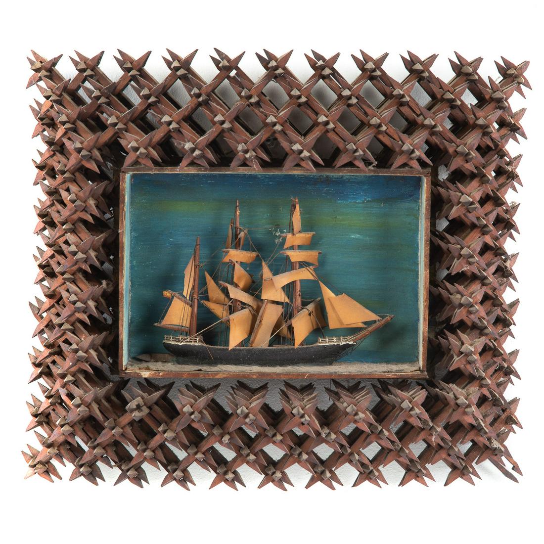 American Tramp Art Type Wood Frame with Ship: First quarter, 20th century; carved wood spike frame housing carved and painted wood three mast ship diorama with painted ocean, frame, 14 in. H., 17 in. W., 6 in. D.