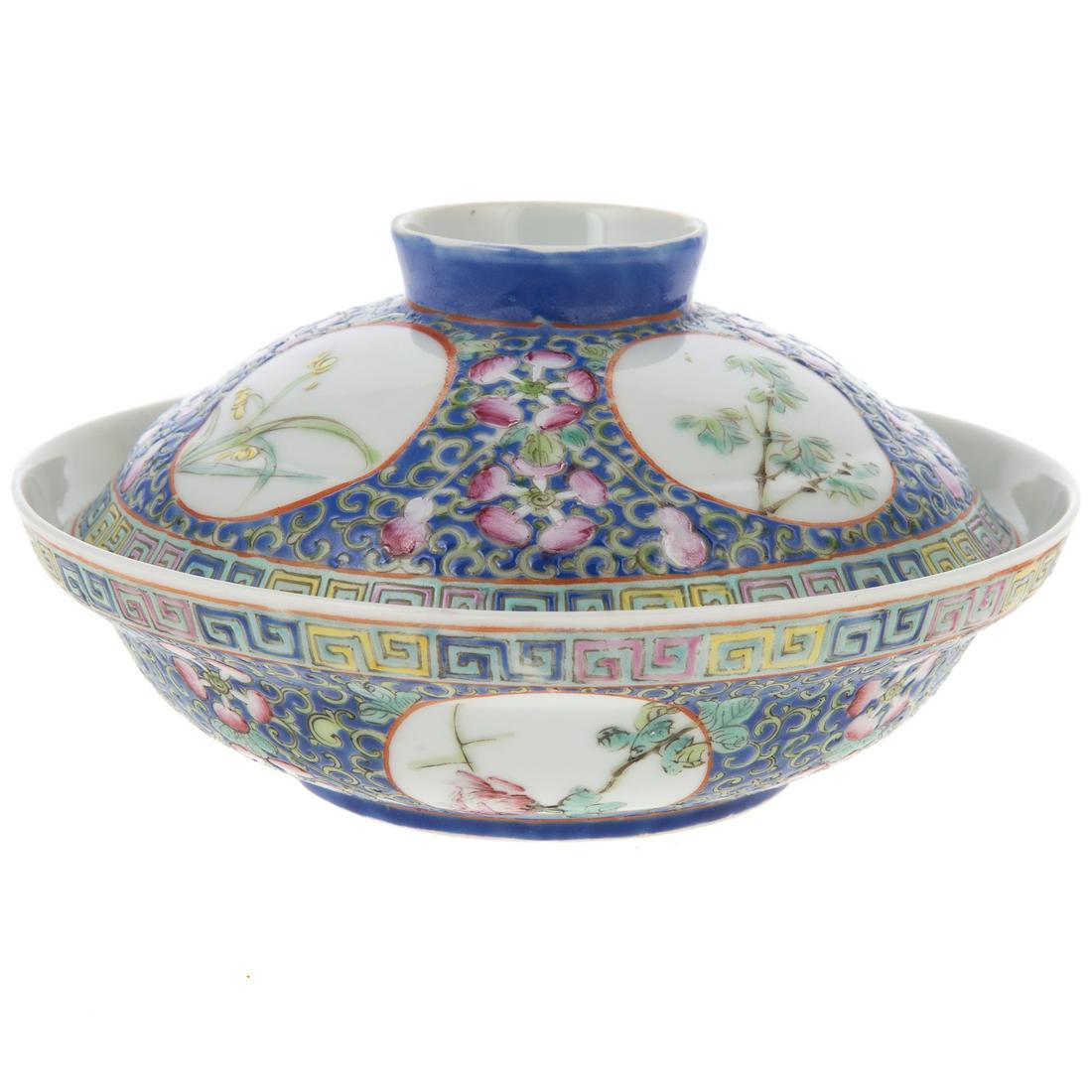 Chinese Export Famille Rose Covered Bowl: Guangzhou Era, circa 1875 powder blue ground with yellow vine and Famille Rose flowers and vignettes with floral and tree decoration, spurious reign mark, with matching lid. 4 in. H., 6 in. Diam.