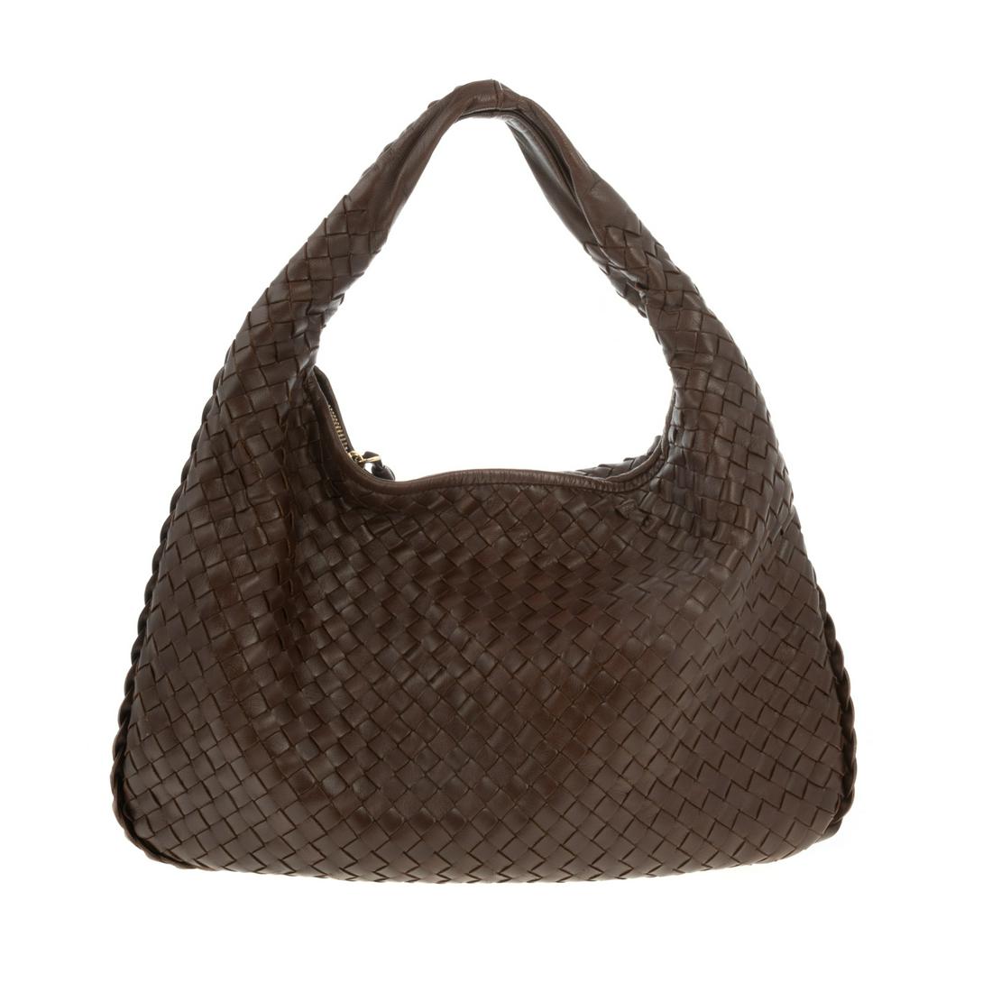 A Bottega Veneta Intrecciato Hobo Shoulder Bag: A brown Intrecciato leather Bottega Veneta Hobo Shoulder Bag with gold tone hardware and rolled shoulder strap. Suede lining with zipper pocket at interior and zipper closure at top. Includes dust bag