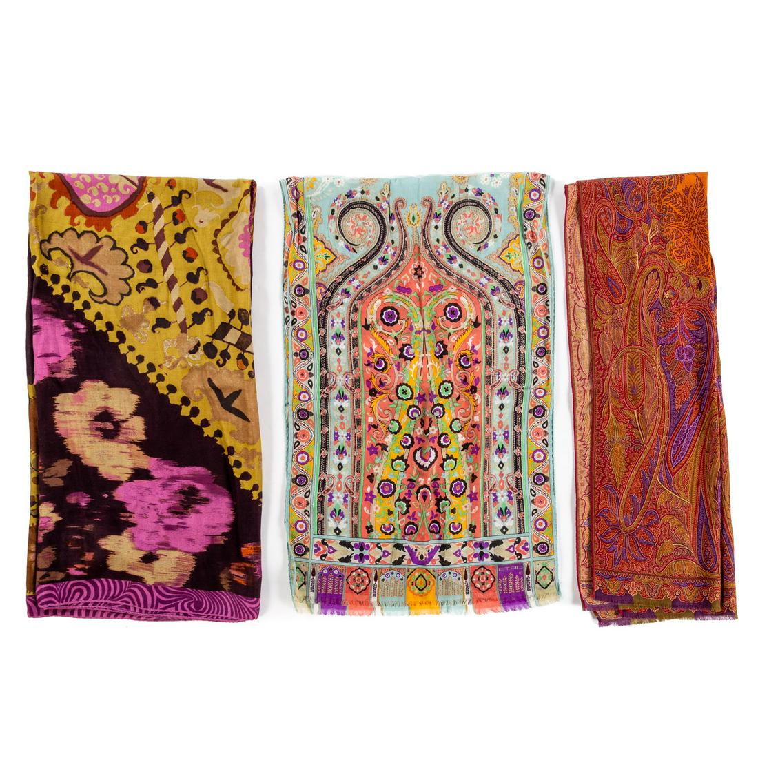 Three Etro Silk, Wool & Cashmere Scarves: 1) A purple and multicolor Etro cashmere and silk scarf with paisley motif and hand rolled edges. Measuring: 51 in. L, 51 in. H, 2) A blue and multicolor Etro silk and wool scarf with paisley motif, f