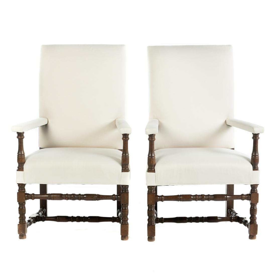 A Pair of Jacobean Style Upholstered Armchairs: Late 19th century; oak frame with contemporary upholstered arms and backs, 47 in. H., 27.5 in. W., 28 in. D. From the Estate of L. Thomas Galloway, Washington, DC, noted collector of modern and contem
