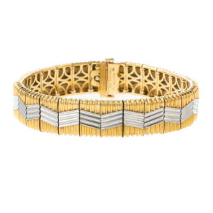 A Michael Bondanza "Heatwave" Bracelet in 18K/Platinum: 18K yellow gold and platinum "Heatwave" bracelet by Michael Bondanza, finely crafted geometric zig-zag design measures 9 mm W and 8 in. L, hidden box clasp with snap under safety, 79.6 grams, current