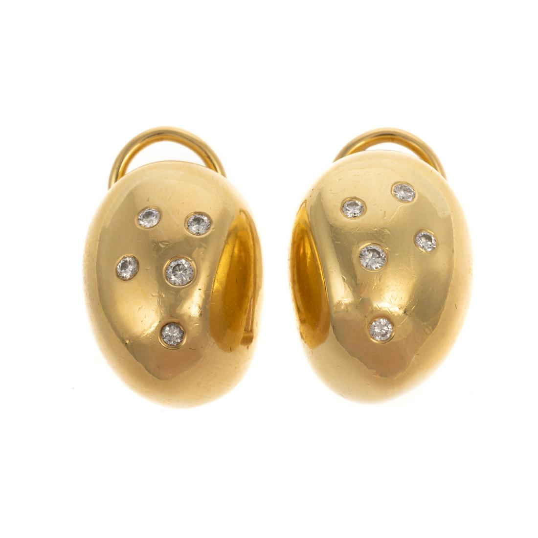A Pair of 18K Robert Lee Morris Diamond Earrings: 18K yellow gold earrings by Robert Lee Morris featuring flush set round cut diamonds, signed "RLM," posts with Omega clip backs, 0.75 in. L, 18.5 grams