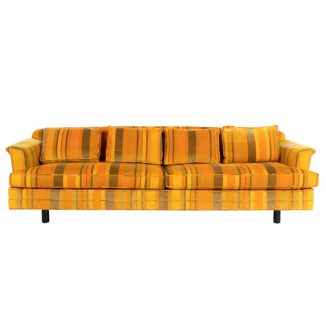 Dunbar Upholstered Sofa, Jack Lenor Larsen Fabric: Mid-Century two- cushion sofa by Dunbar, with custom fabric by iconic textile designer Jack Lenor Larsen, with circular ebonized wooden legs, sofa is unmarked, 28 in. H., 100 in. L., 32 in. D.