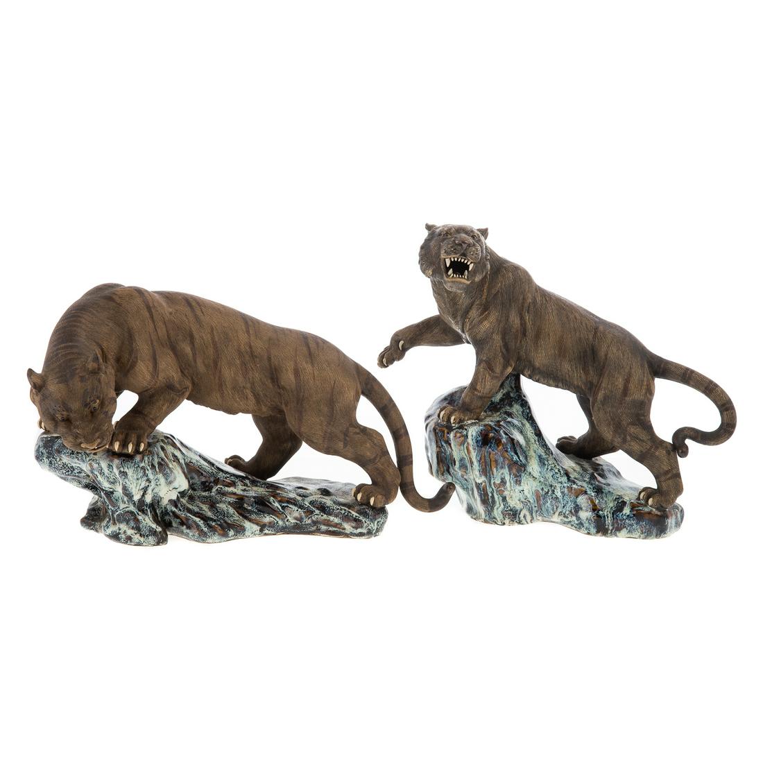 A Pair of Chinese Export Tigers: Guangxu Era, 1875-1908 prowling textured bisque tigers, with porcelain teeth and claws, on flambe enamel glazed rocky base, impressed "China." Approx. 10 in. H., 11 in. L., for each.