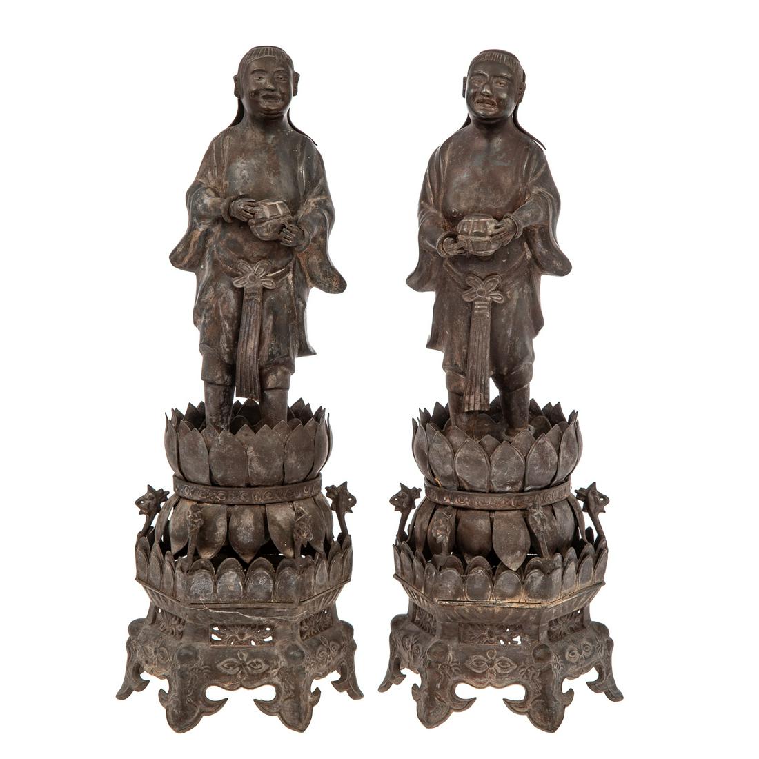 A Pair of Chinese Pewter Devotional Figures: Qianlong Era, circa 1770-80 standing Daoist figure on double lotus base, on hexagonal footed base. 15 1/2 in. H.