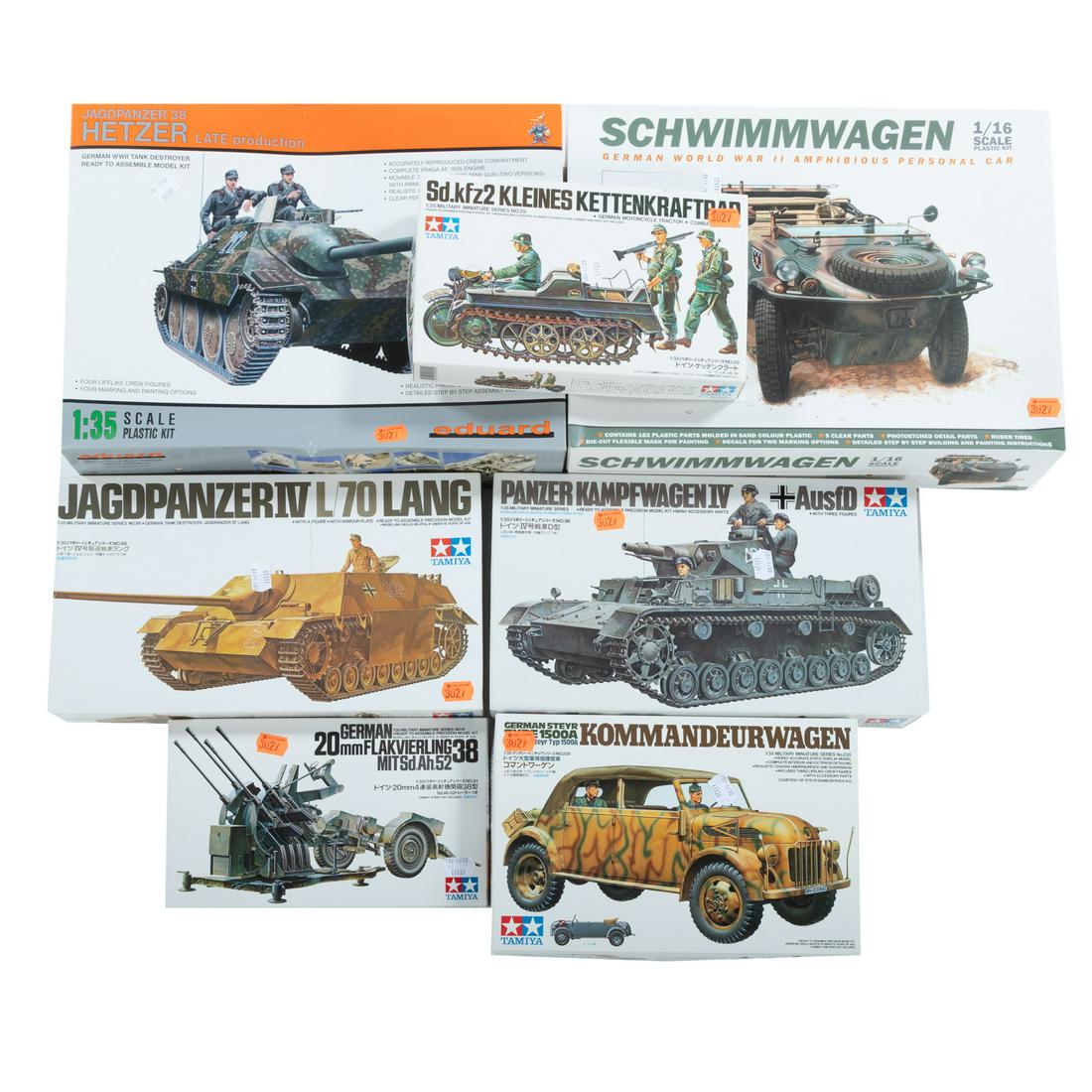 Seven WWII German Tank & Car Models: Includes Hetzer tank destroyer, Jagdpanzer IV tank destroyer, Panzer IV Kampfwagen, Schwimmwagen, 20mm anti-aircraft gun, and Kettenkraftrad. All unbuilt in original boxes.