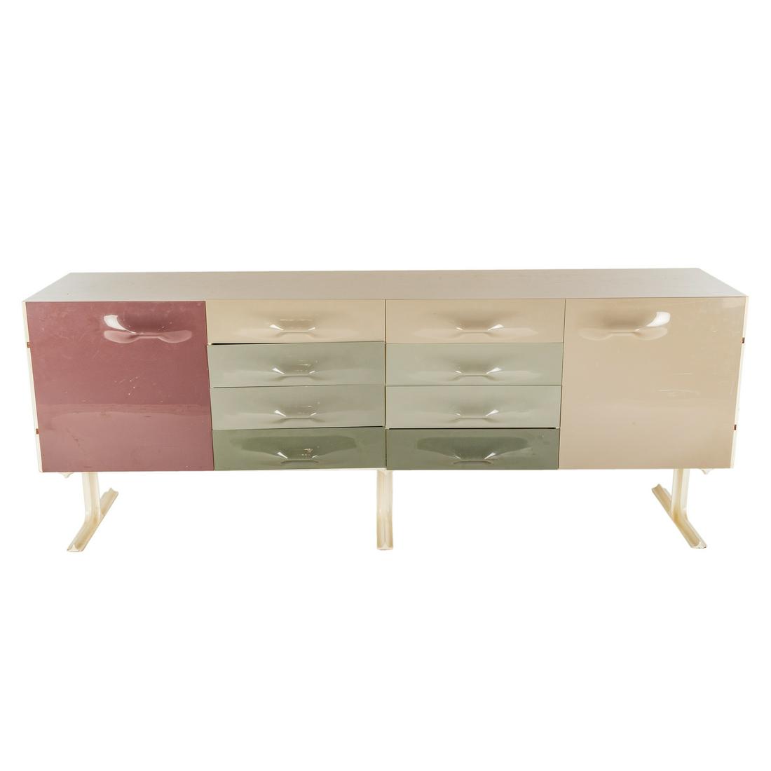 Raymond Loewy Style Credenza, by Organic Modernism: 21st century; modern credenza with eight molded plastic drawers flanked by a pair of cabinet doors, on three metal support legs, 29.5 in. H., 79 in. W., 19.5 in. D.
